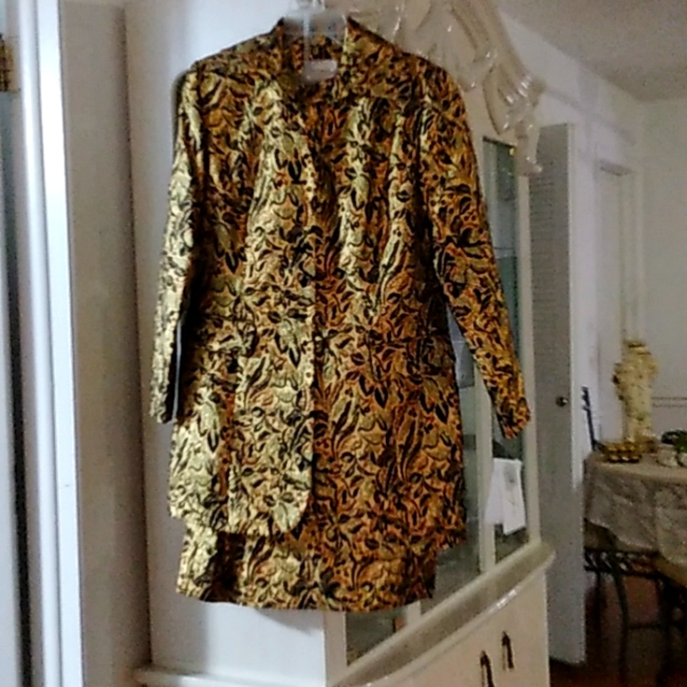 A gold and black Terramina suit